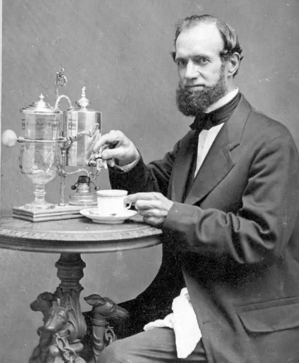 Abel Breed with a coffee maker made with silver from the Cariobu Mill